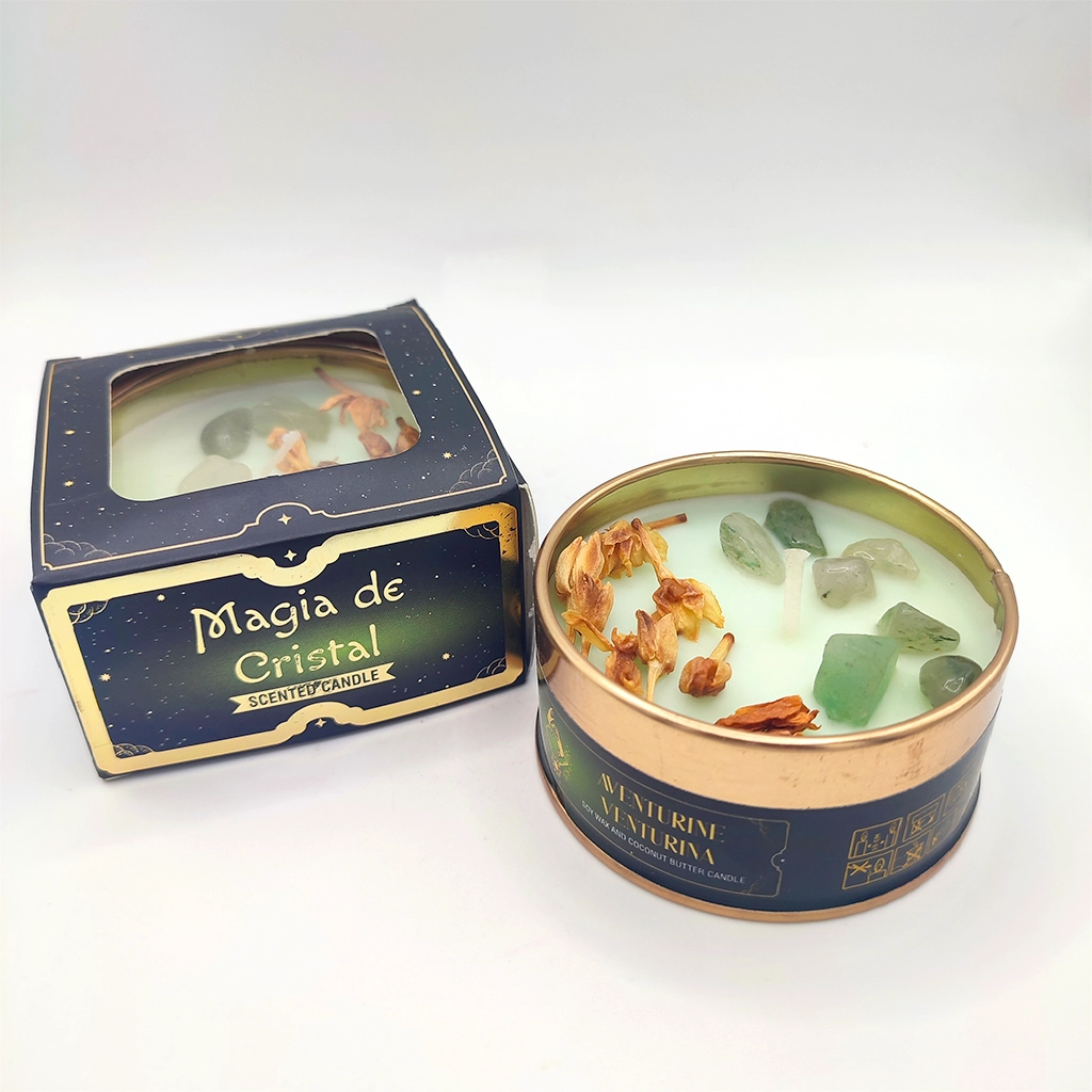 Vela Magia de Cristal Aventurina con minerales naturales decorando la cera junto a su caja