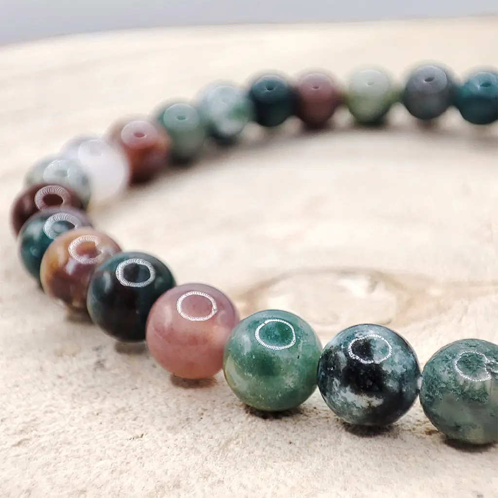Pulsera Ágata India 6 mm Pulsera de Ágata India de 6 mm con tonos verdes y terrosos naturales.