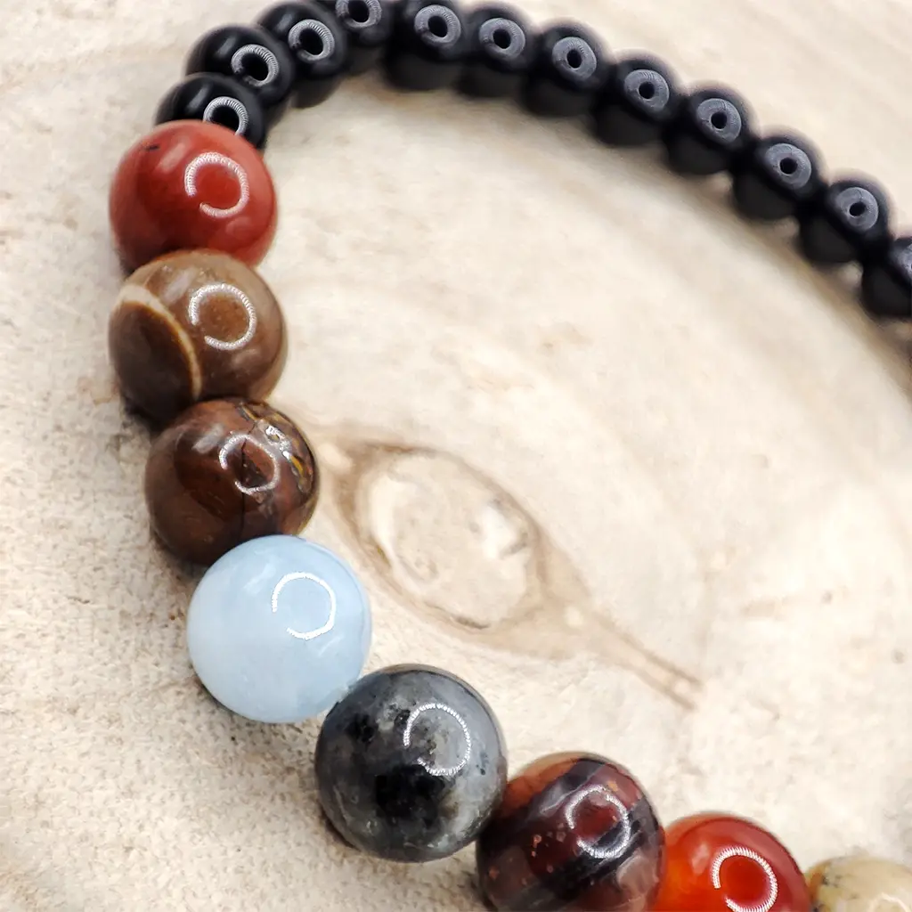 Pulsera Armonía Cósmica de Minerales Planetarios 6 mm Pulsera de minerales planetarios de 6 mm inspirada en las energías del sistema solar para armonía y equilibrio energético.