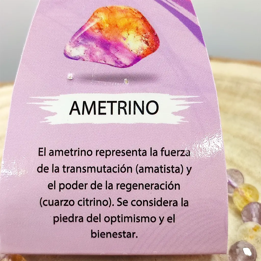 Pulsera facetada de Ametrino natural 6 mm Pulsera facetada de Ametrino natural de 6 mm con tonos violetas y dorados para claridad mental y equilibrio energético.