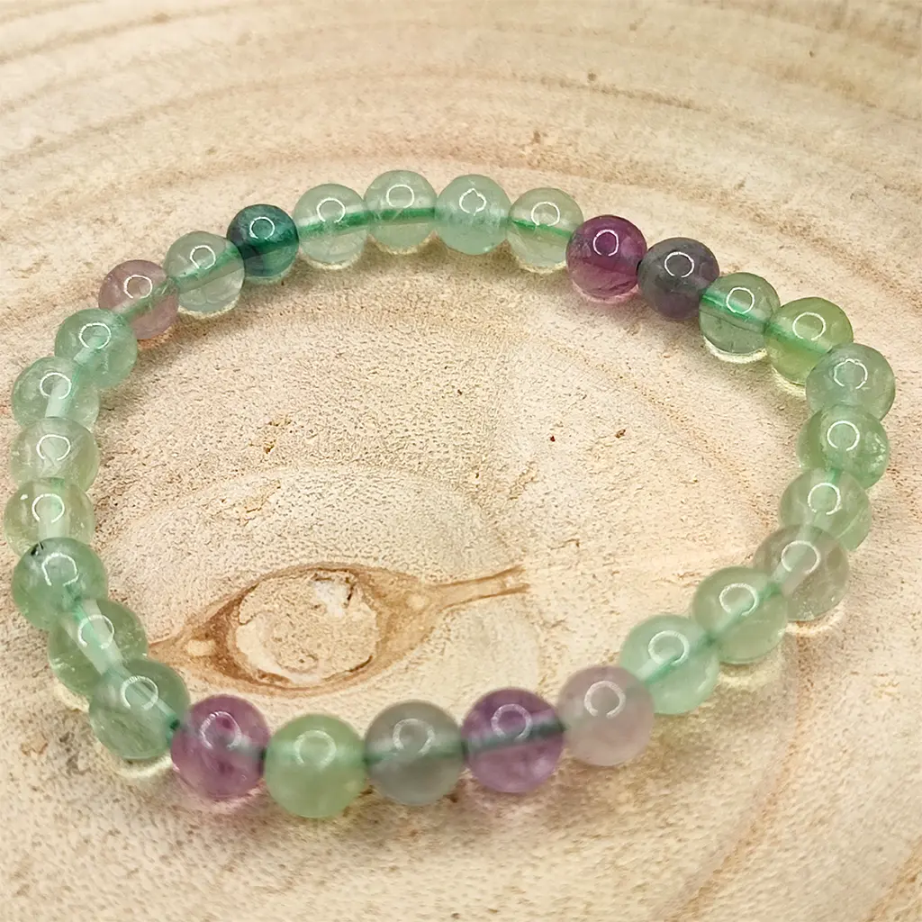 Pulsera de Fluorita natural de 6 mm en tonos verdes y violetas.