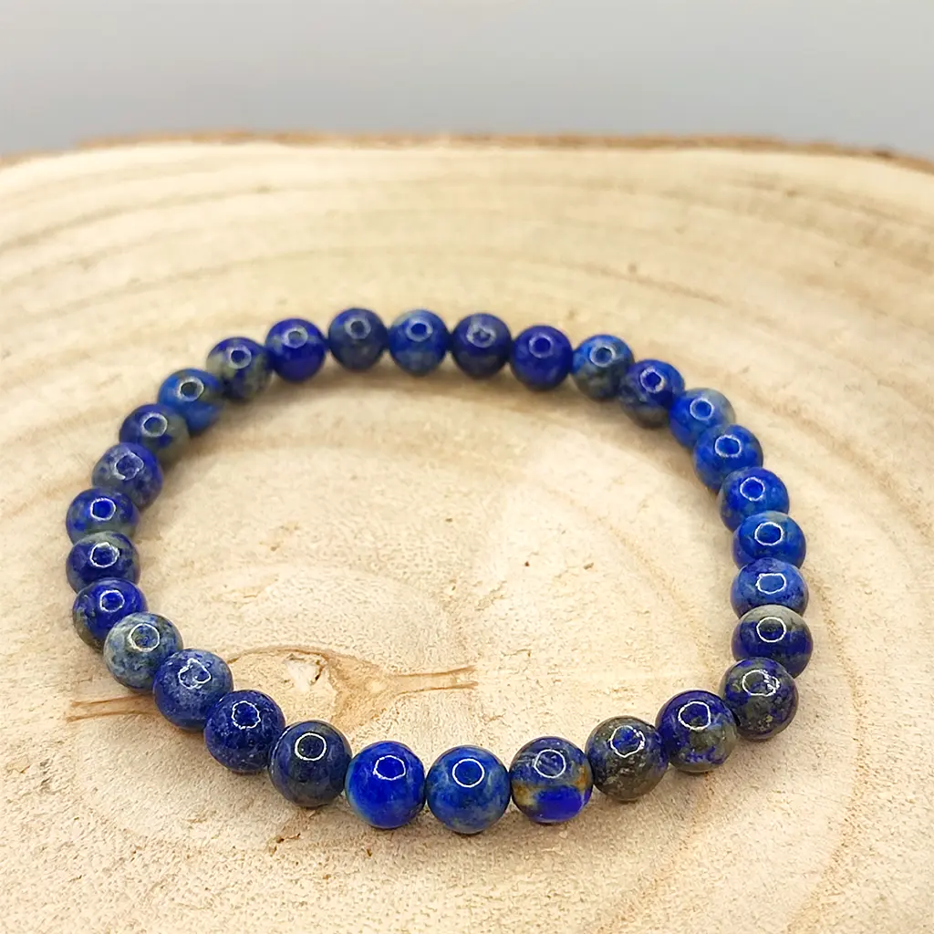 Pulsera de Lapislázuli natural de 6 mm con tonalidades azul intenso.