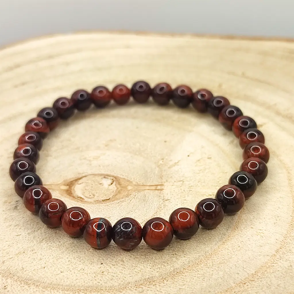 Pulsera de Ojo de Buey natural de 6 mm en tonos rojizos y marrones.