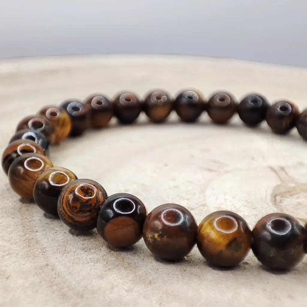 Pulsera de Ojo de Tigre natural de 6 mm con reflejos dorados y marrones.