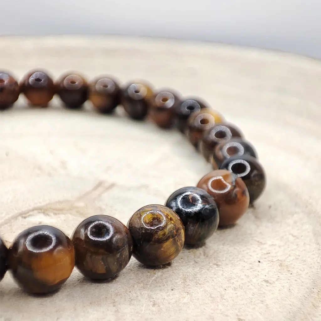 Pulsera de Ojo de Tigre natural de 6 mm con reflejos dorados y marrones.