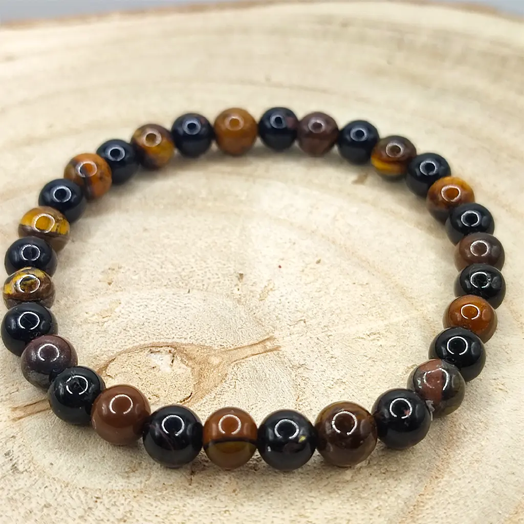 Pulsera de Ojo de Tigre y Turmalina Negra natural de 6 mm para protección energética y fortalecimiento personal.