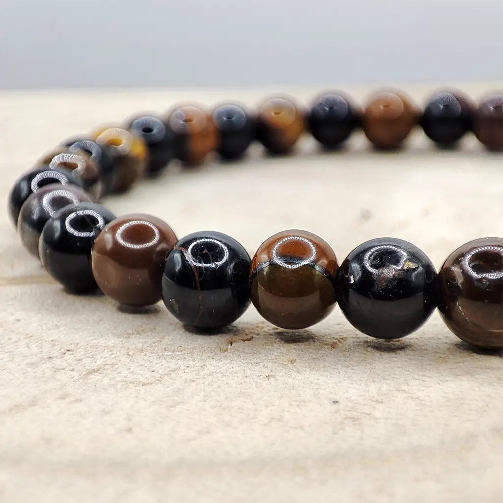 Pulsera Protección contra la Envidia de Ojo de Tigre y Turmalina Negra 6 mm Pulsera de Ojo de Tigre y Turmalina Negra natural de 6 mm para protección energética y fortalecimiento personal.