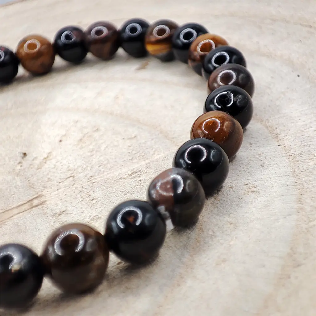 Pulsera Protección contra la Envidia de Ojo de Tigre y Turmalina Negra 6 mm Pulsera de Ojo de Tigre y Turmalina Negra natural de 6 mm para protección energética y fortalecimiento personal.