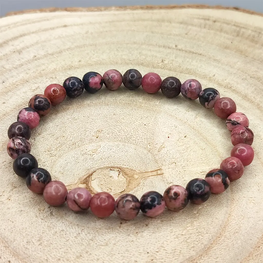 Pulsera de Rodonita de 6 mm con tonos rosados y vetas oscuras naturales.