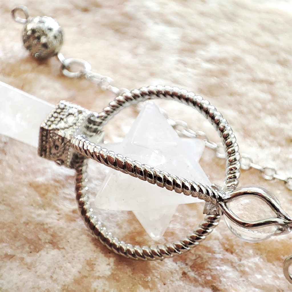 Péndulo Merkaba de Cuarzo Blanco Péndulo Merkaba de cuarzo blanco con punta de cuarzo blanco