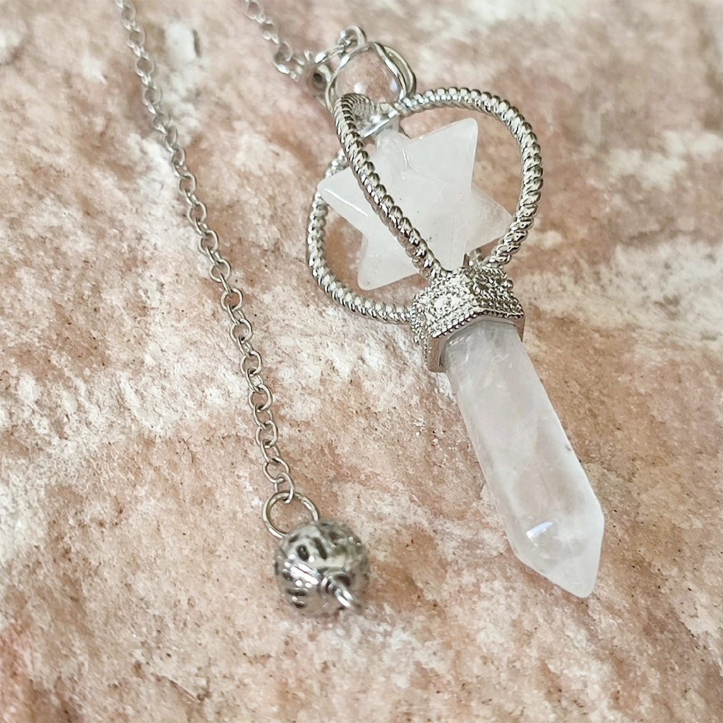 Péndulo Merkaba de Cuarzo Blanco Péndulo Merkaba de cuarzo blanco con punta de cuarzo blanco